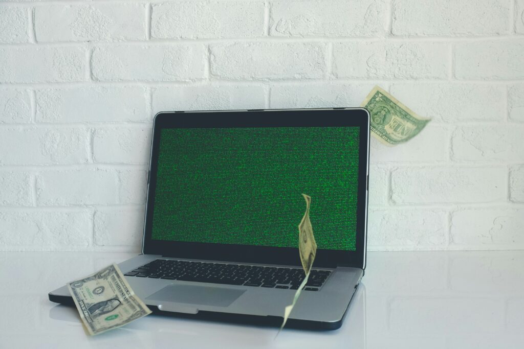 macbook pro with a dollar bill